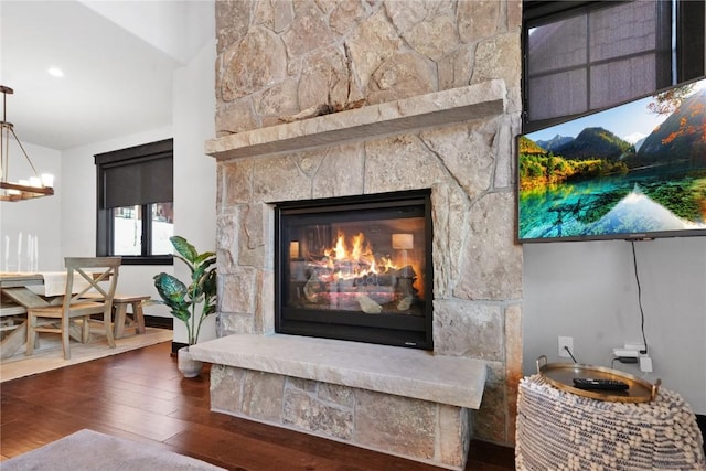 room details with wood finished floors and a fireplace