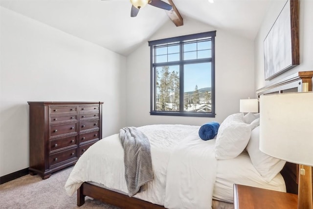 bedroom featuring ceiling fan, lofted ceiling with beams, and light carpet