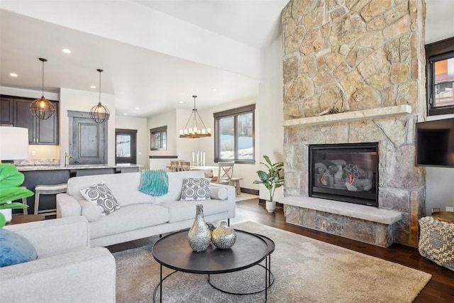 living room featuring a fireplace and dark hardwood / wood-style flooring