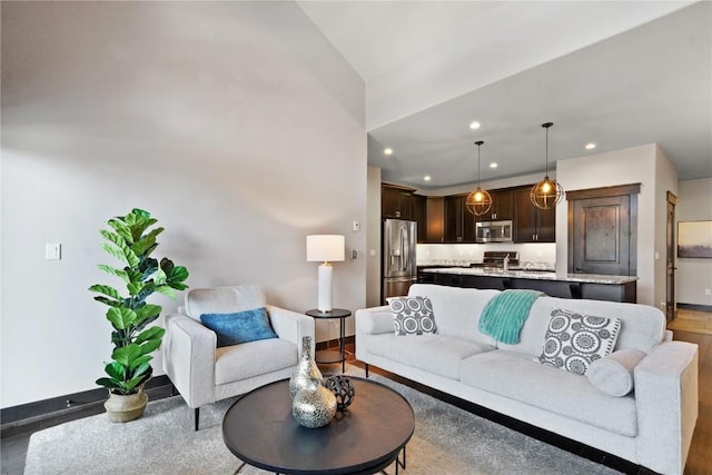 living room with recessed lighting and baseboards