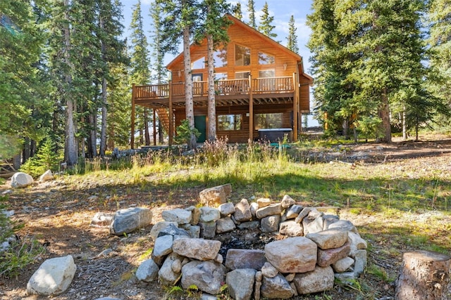 back of property with a wooden deck