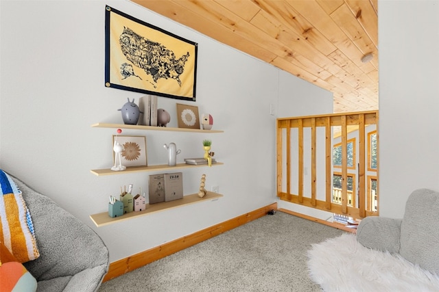 sitting room with lofted ceiling, wooden ceiling, and carpet floors