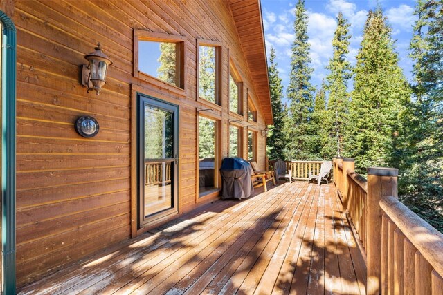 wooden terrace featuring area for grilling