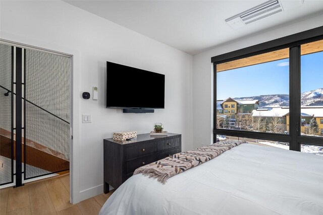 bedroom featuring light wood-type flooring