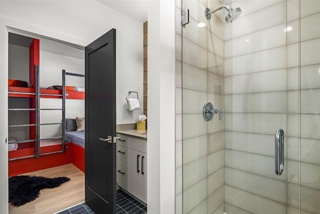 bathroom featuring an enclosed shower and vanity