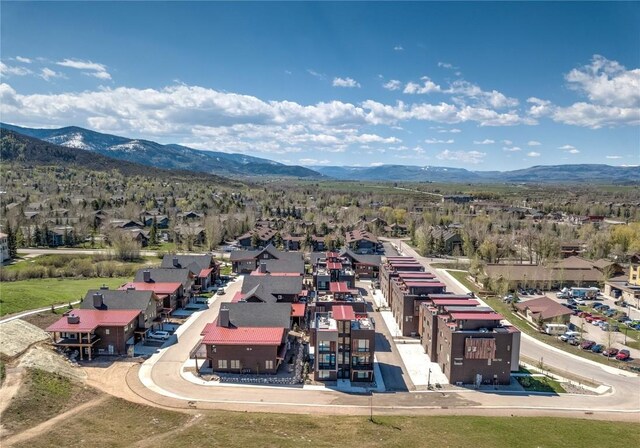 drone / aerial view featuring a mountain view