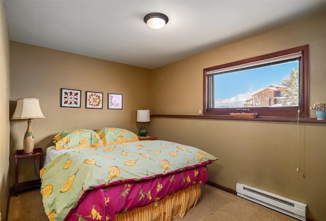 carpeted bedroom with a baseboard heating unit