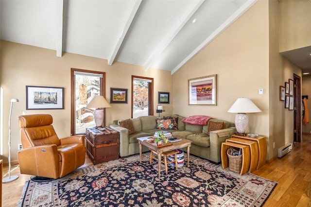 living room featuring a baseboard radiator, vaulted ceiling with beams, and light hardwood / wood-style flooring