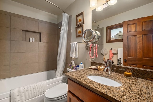 full bathroom with shower / tub combo with curtain, vanity, and toilet