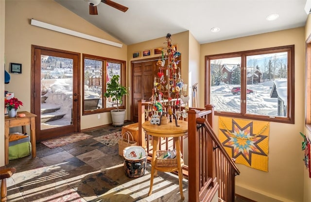 dining room with lofted ceiling and a wealth of natural light