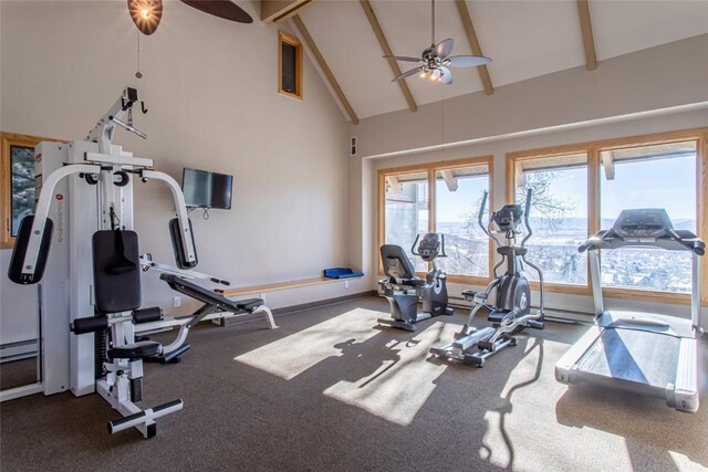 exercise room with baseboards, high vaulted ceiling, and ceiling fan