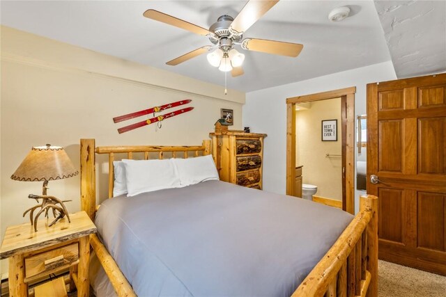 bedroom with ensuite bath and ceiling fan