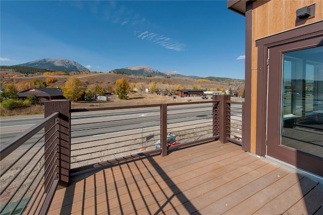 wooden deck with a mountain view