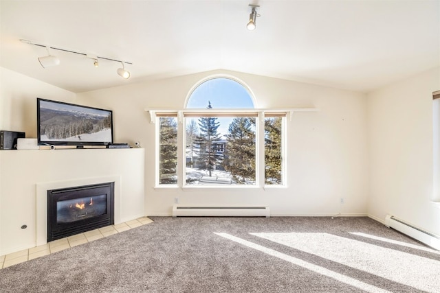 unfurnished living room featuring light colored carpet, vaulted ceiling, and a baseboard heating unit