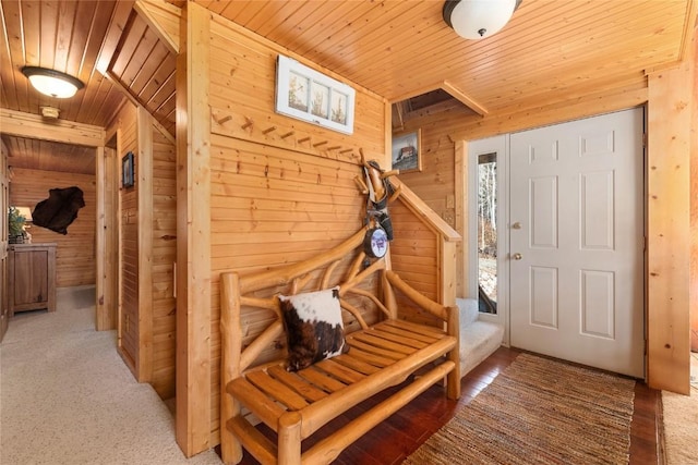 mudroom featuring wood walls and wood ceiling