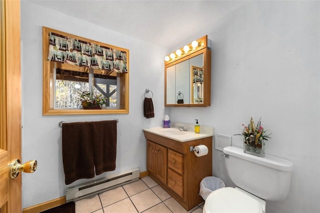 bathroom with tile patterned floors, toilet, vanity, and a baseboard heating unit