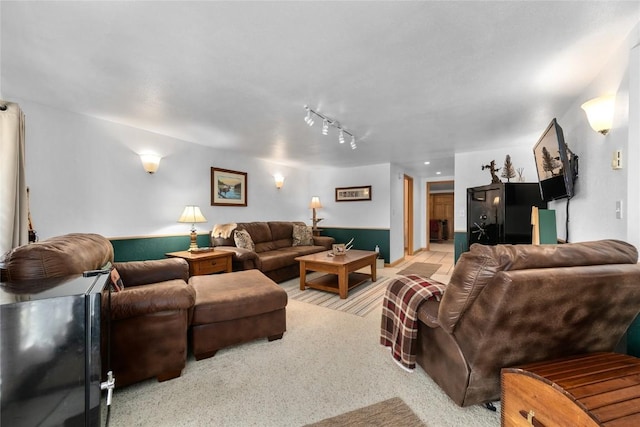 living room featuring rail lighting