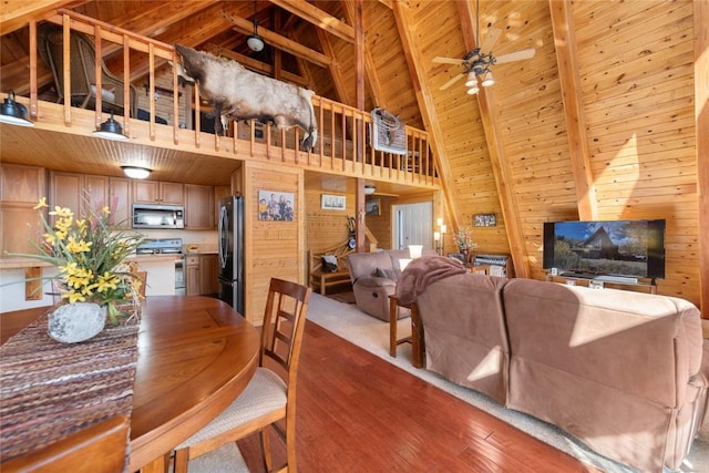 dining space featuring beam ceiling, ceiling fan, wooden ceiling, high vaulted ceiling, and hardwood / wood-style flooring