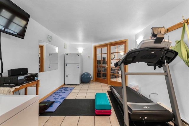 workout room with french doors and light tile patterned flooring