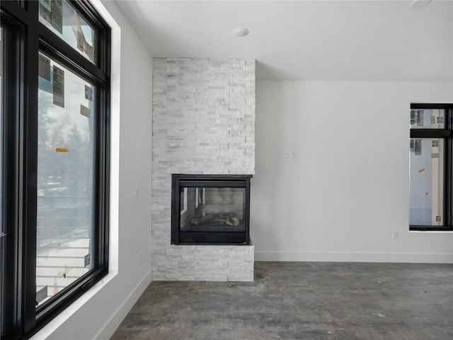 unfurnished living room with a fireplace