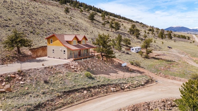 birds eye view of property featuring a mountain view