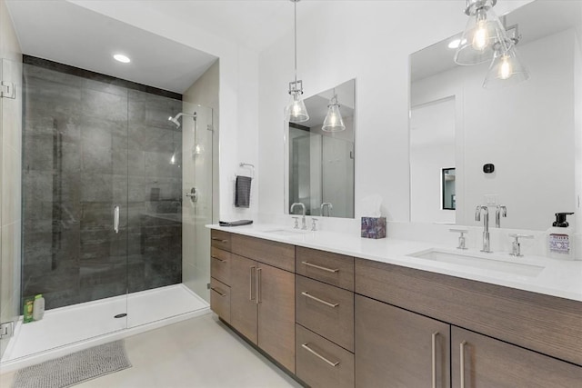 bathroom featuring tile patterned flooring, vanity, and a shower with door