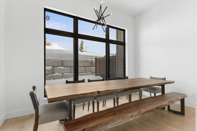 dining room featuring a chandelier and light hardwood / wood-style floors