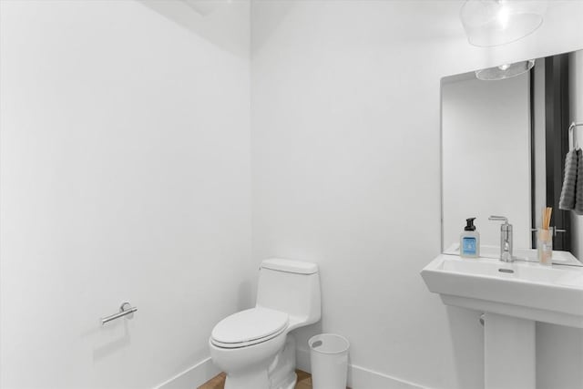 bathroom with toilet and sink