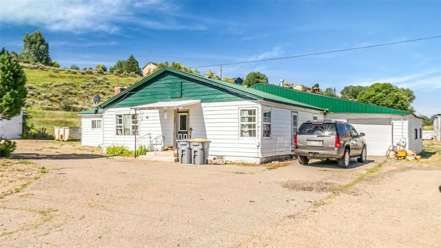 bungalow-style home with a garage