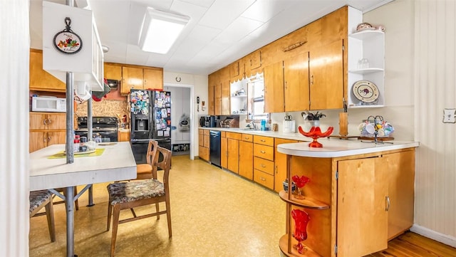 kitchen featuring black appliances and sink