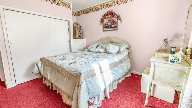 bedroom with carpet and a closet