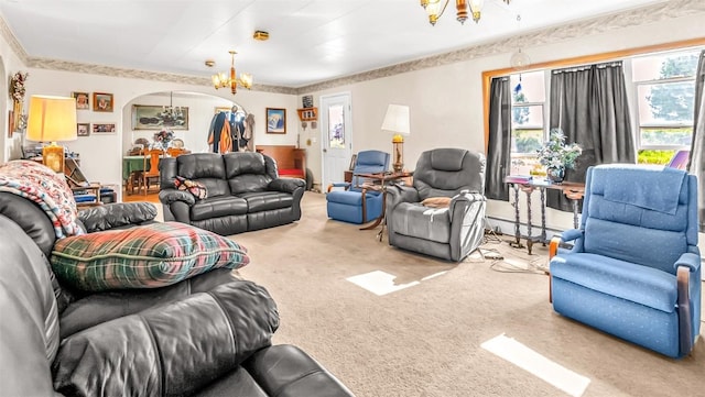 living room featuring a baseboard heating unit, carpet floors, and a notable chandelier