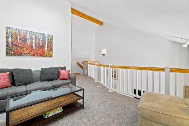 living room featuring lofted ceiling with beams and carpet floors