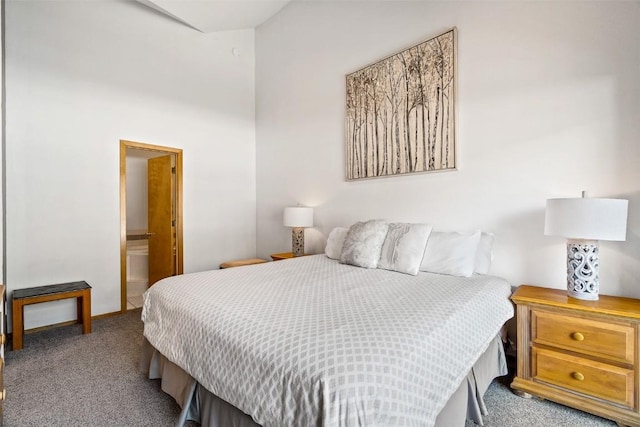 bedroom featuring carpet floors and connected bathroom