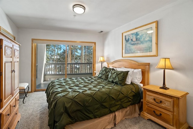 carpeted bedroom featuring visible vents and access to exterior