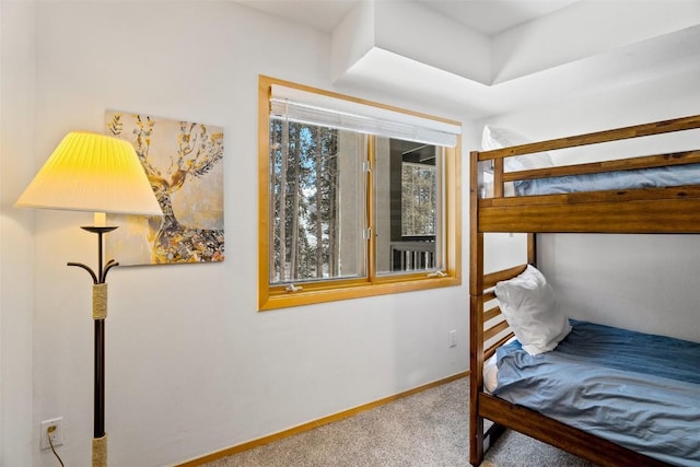 bedroom featuring carpet flooring and baseboards