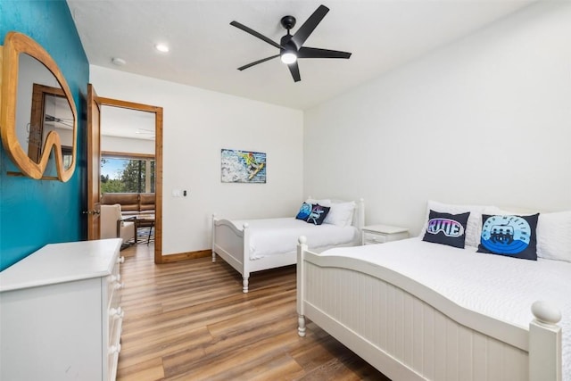 bedroom featuring wood-type flooring and ceiling fan