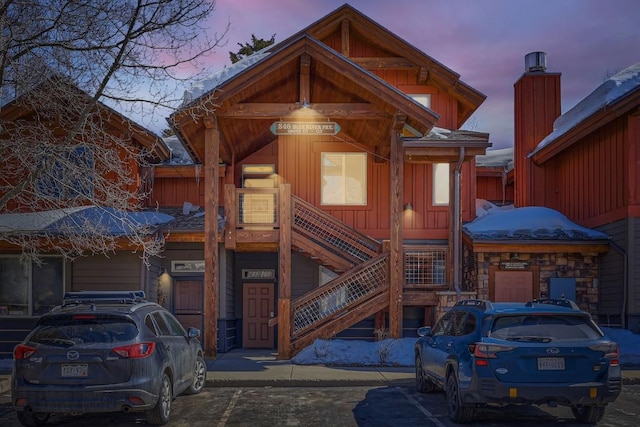 exterior space with stairs and board and batten siding