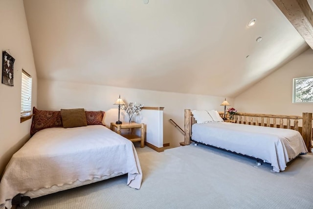 bedroom with lofted ceiling and carpet floors