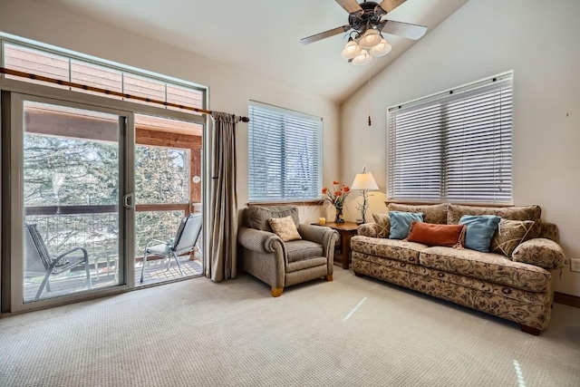 living area with carpet flooring, lofted ceiling, and a ceiling fan