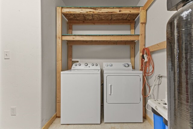 washroom featuring washer and dryer