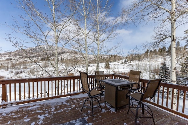 view of snow covered deck