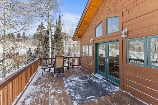 view of snow covered deck