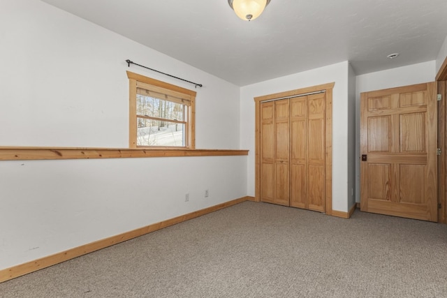 unfurnished bedroom featuring a closet and carpet