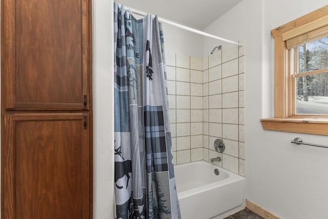 bathroom featuring shower / tub combo with curtain