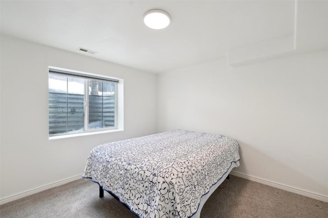 bedroom with visible vents, baseboards, and carpet