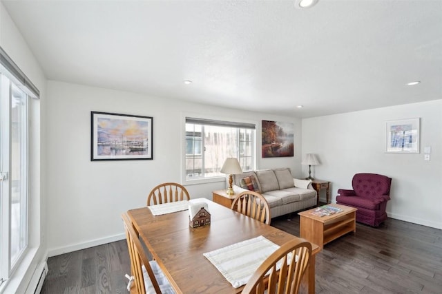 dining room with a baseboard heating unit, recessed lighting, dark wood-style floors, and baseboards