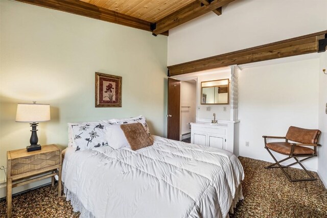 bedroom featuring beam ceiling, sink, ensuite bathroom, carpet, and wood ceiling