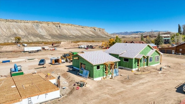 birds eye view of property with a mountain view