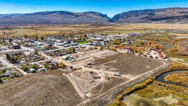 birds eye view of property featuring a mountain view